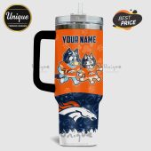 Personalized orange tumbler featuring Bluey and Bingo wearing Denver Broncos gear; Broncos logo at the bottom.!