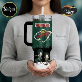 Tumbler with hockey-themed design, including cartoon dogs, the Minnesota Wild logo, and customizable name text.!