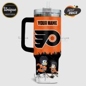 Personalized orange tumbler featuring a hockey team logo and cartoon dogs in hockey gear.!