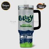 Tumbler features 'Bluey' text, Seattle Seahawks logo, and paw prints design.!