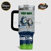 Personalized tumbler with cartoon dogs in football gear and a Seahawks logo.!