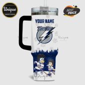 White tumbler featuring 'Your Name' above a Tampa Bay logo, paw prints, and cartoon dogs in hockey gear!