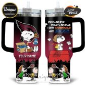 Cardinals Snoopy and Charlie Brown football 40oz tumbler with custom name.