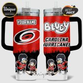 Tumbler featuring 'YOUR NAME', 'Bluey', Carolina Hurricanes logo, and Bluey characters playing hockey on a red paw print background.!