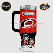 Red tumbler with Carolina Hurricanes logo, paw prints, cartoon dogs in hockey gear, and customizable name field.!