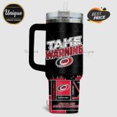 Black tumbler with Carolina Hurricanes hockey design and 'Take Warning' text.!