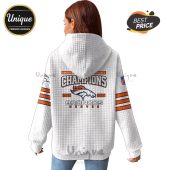 Back of a white hoodie with a Denver Broncos Champions design and orange stripes on the sleeves.!