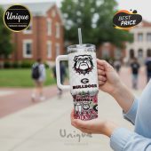White tumbler with handle, featuring the Georgia Bulldogs logo and graphics.!