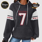 Black quilted hoodie with white stripes on the sleeves, featuring the word 
