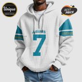 White hoodie with 'Jaguars' and number 7 in teal, plus teal/gold sleeve stripes.!