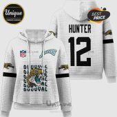 White hoodie with Jaguars theme. Displays a jaguar, 'DUUUVAL' text, NFL logo, and name/number 'HUNTER 12'.!