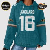 Teal hoodie featuring Jaguars text with number 16 and jaguar logos on sleeves.!