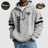 Jacksonville Jaguars zip-up hoodie with team logos and text.!