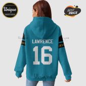 Back of a light blue hoodie with 'LAWRENCE' and '16' in white, plus team colors on the sleeves.!