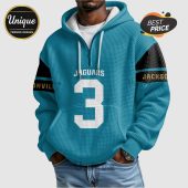 Teal hoodie with 'Jaguars' '3' and 'Jacksonville' text, with black and gold stripes on the sleeves.!