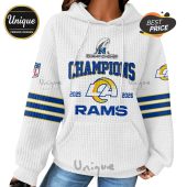 White hoodie with the LA Rams logo, 'Champions,' and the years 2025-2026 design.!