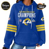 Blue hoodie with LA Rams design, text 'National Football Conference Champions' and Super Bowl logo.!