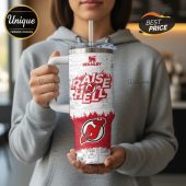 Stanley travel mug featuring 'Raise Hell' text, the New Jersey Devils logo, and Peanuts comic strip art.!