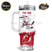 Customizable hockey tumbler featuring Snoopy dressed as a New Jersey Devils player with space for 'YOUR NAME'!