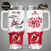Customizable mug featuring a Snoopy cartoon and NJ Devils logo with comic strip panels and 'Raise Hell' text!