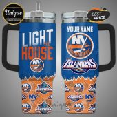 Customizable New York Islanders stainless steel tumbler with handle and straw. Features team logos and 'Light the House' text.!