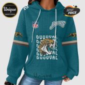 Jacksonville Jaguars teal hoodie with the NFL logo and Jaguar face.!
