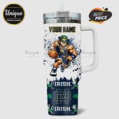 White handled tumbler with a personalized name, Fighting Irish player art, shamrocks and team logo.!