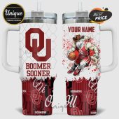 OU Sooners tumbler with the team logo, Boomer Sooner text, and a horse cartoon character playing basketball.!
