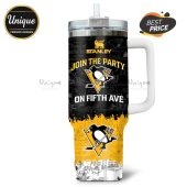 Stanley tumbler featuring a Peanuts cartoon style design with the Pittsburgh Penguins logo.!