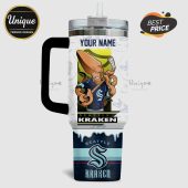 Tumbler features a cartoon octopus playing hockey with Seattle Kraken logos and customizable name section.!