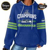 Blue hoodie with 'Champions' text and Seahawks logo, years 2025 and 2026.!