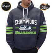 A man wears a hoodie with a Seattle Seahawks championship design, featuring the years 2025-2026 and the team logo.!