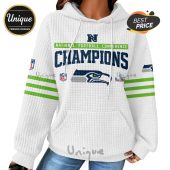 White hoodie with Seattle Seahawks logo, 'Champions' text, and green stripes on sleeves.!