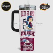 Colorado Avalanche tumbler features Snoopy, Woodstock, Charlie Brown with hockey gear, plus team logos and 'Let's Go Avs!' text.!