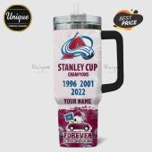 Stanley Cup Champions tumbler featuring the Colorado Avalanche logo and Snoopy driving a car with the team flag.!
