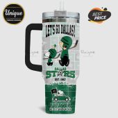 Tumbler with Snoopy and Charlie Brown in Dallas Stars hockey gear, text 'Let's Go Dallas!', and team logo.!