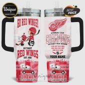 Detroit Red Wings tumbler featuring Snoopy and Charlie Brown with hockey sticks and championship years!
