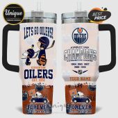 Two-sided view of a white travel mug, featuring an Edmonton Oilers hockey theme with Snoopy characters and Stanley Cup wins.!