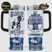 Toronto Maple Leafs tumbler featuring Snoopy, Charlie Brown, 'Go Leafs Go!' and Stanley Cup Champions text.!