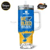 Stanley Tumbler shows Peanuts comic strips and the text 'We Bleed Blue'.!