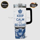 Toronto Maple Leafs themed tumbler with 'Keep Calm and Be-Leaf' text and hockey icons.!