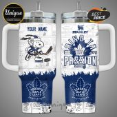 Personalized Stanley mug features Peanuts characters playing for the Toronto Maple Leafs hockey team.!