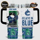 Vancouver Canucks Orca design on a white handled tumbler, says 'Believe in Blue.'!