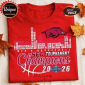 Red collegiate basketball tee! White, maroon SEC Tournament Champions 2026 graphic with Razorback logo, player names, and skyline!