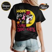 Black tee with 'Hope for a Cure Buc-ee's' text, pink ribbon, cartoon beaver graphic. Yellow, white, pink, orange colors!