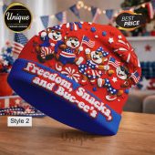 Red & blue beanie with cartoon beaver characters, US flags, stars. Text: Freedom, Snacks, and Buc-ee's! Patriotic style.!