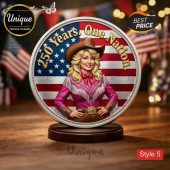 Silver-rimmed commemorative coin, American flag background, Dolly Parton-like character, pink fringe shirt, cowboy hat! Text: 250 Years. One Nation!