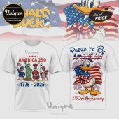 White patriotic Donald Duck tee, cartoon figures, American flag, fireworks, text 