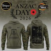 Olive hoodie with camouflage sleeves, featuring 'ANZAC Day 2026', a poppy, the Australian flag, & Fremantle Dockers logos.!