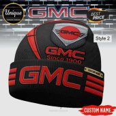 Black beanie with red GMC logo, reads 'Since 1900', plus custom name option. Car enthusiast apparel!
